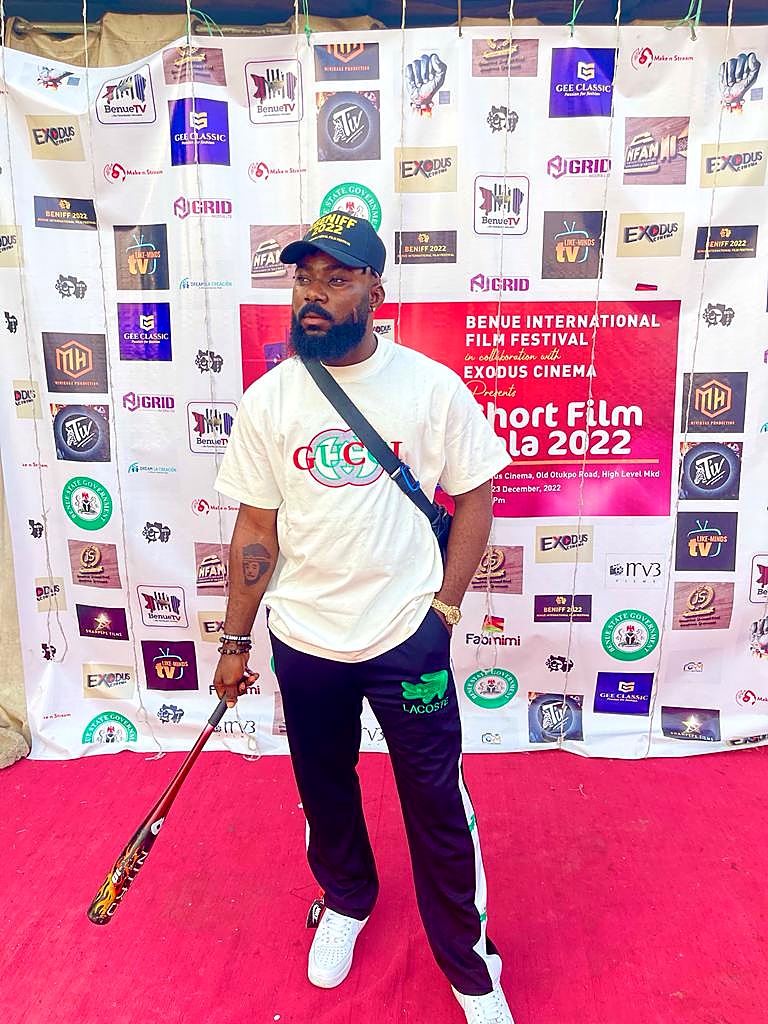 A guest posing on the red carpet at the Benue Short Films Gala 2022