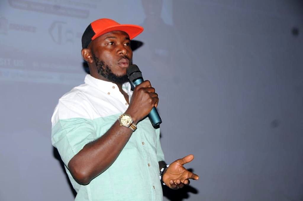 A speaker with a microphone during the Benue Short Films Gala programme