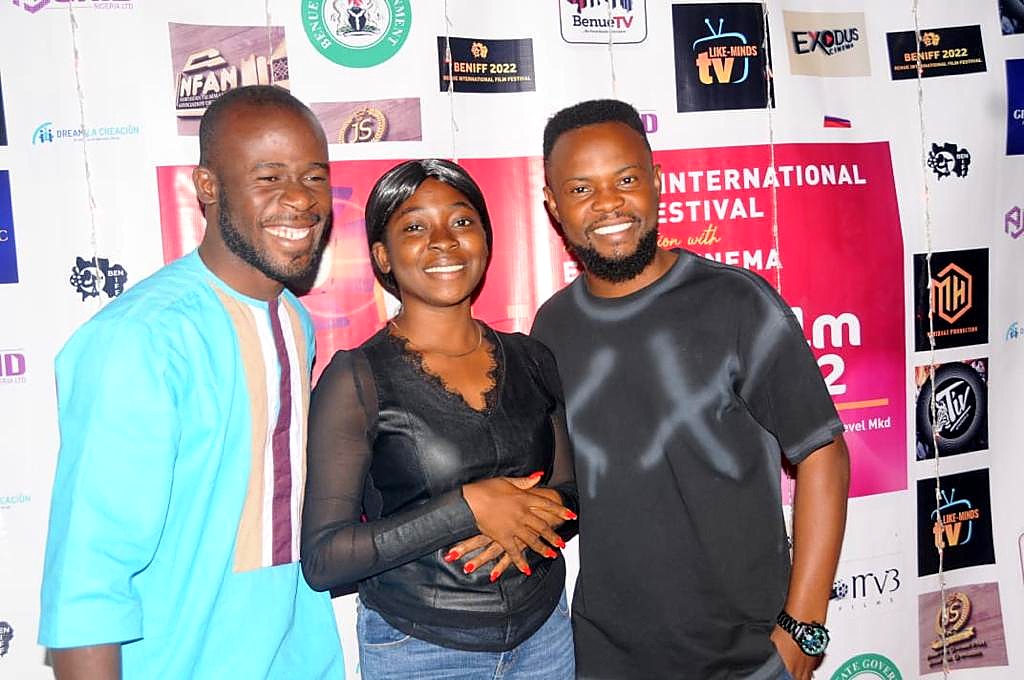 Three guests together in front of the Short Film Gala 2022 backdrop